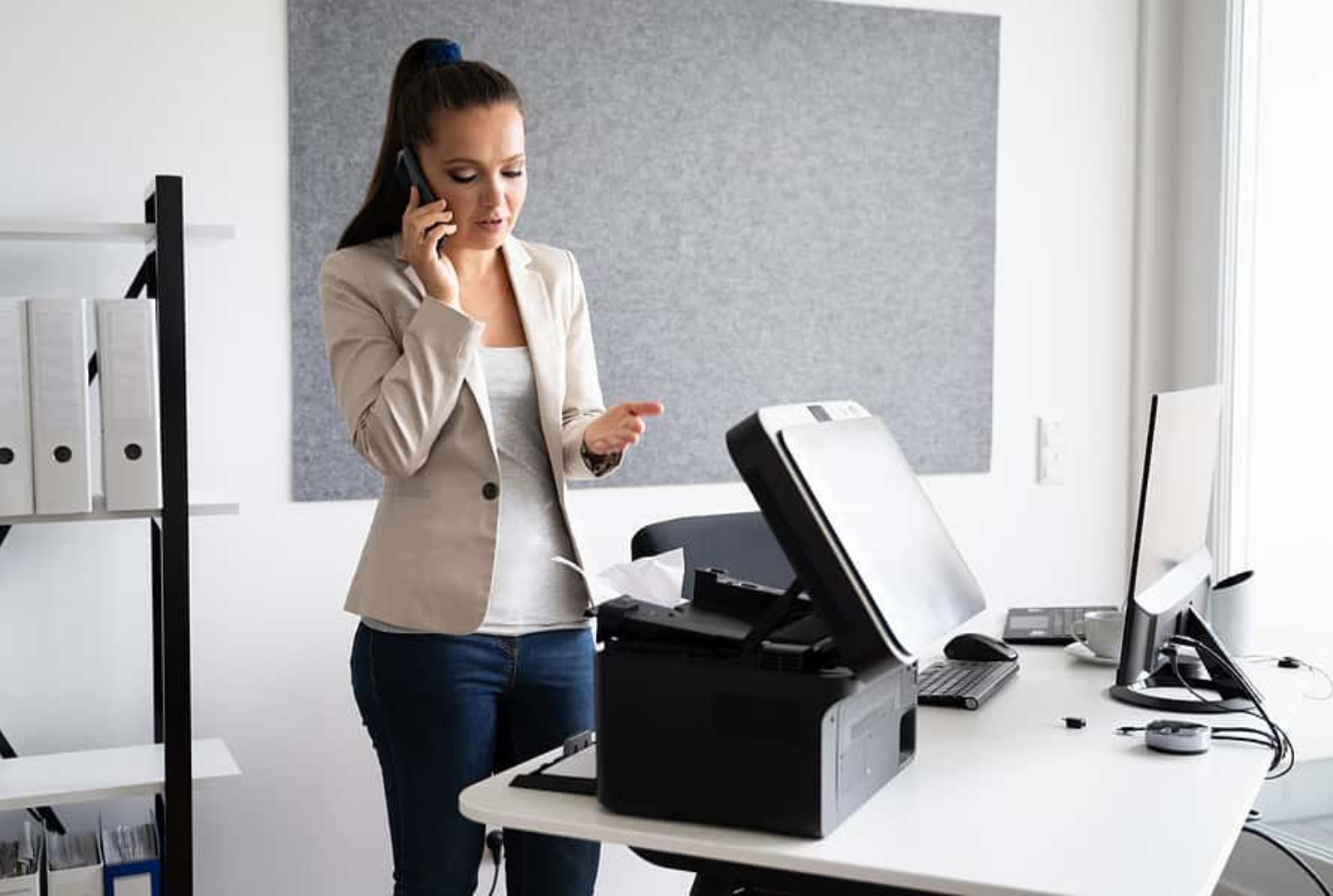 Annoyed business woman broken printer Bigstock