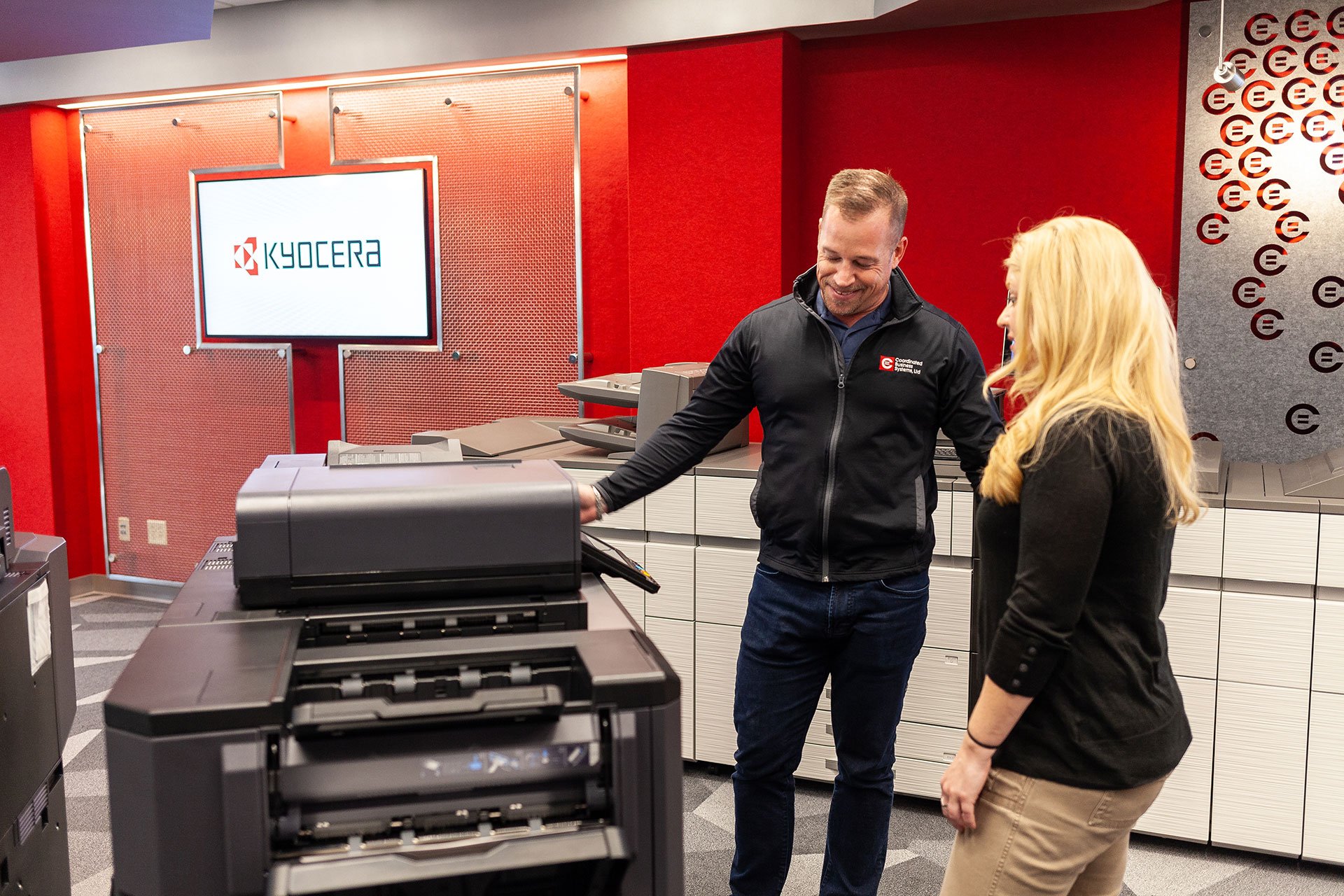 Coordinated Team Member Showing Copier