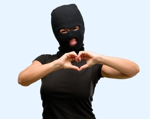 bigstock-Burglar-terrorist-woman-wearin-238478110-794217-edited